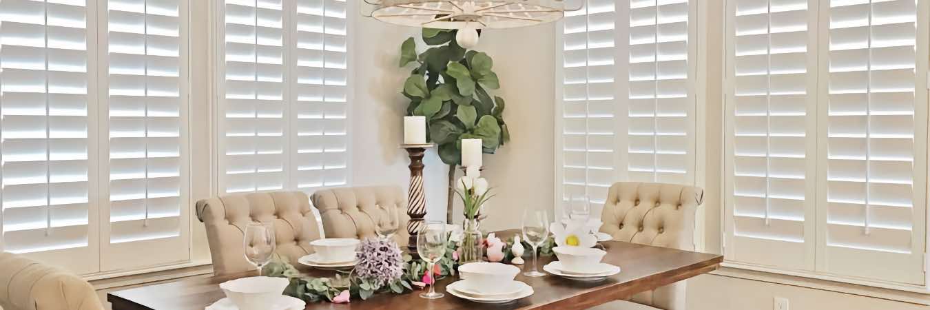 Polywood shutters on windows in an elegant dining room