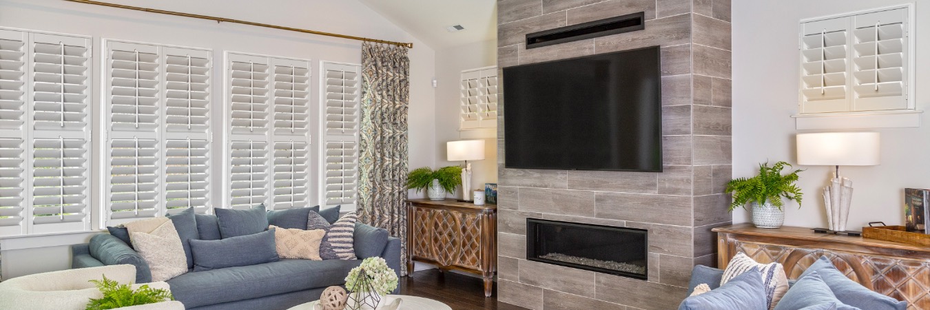 Plantation shutters in Panguitch family room with fireplace