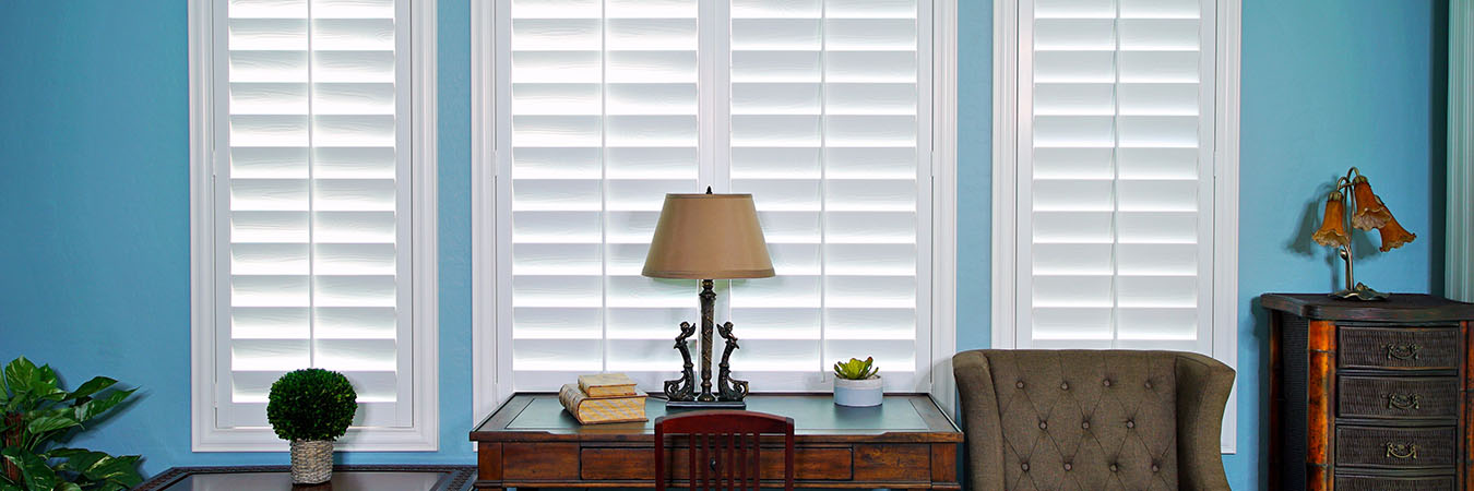 White Polywood shutters in a blue-painted room