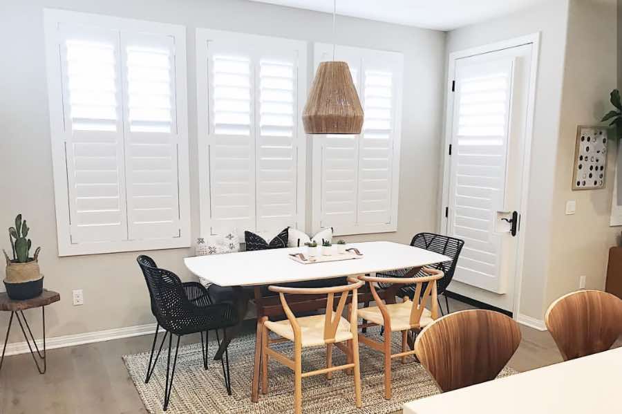 Use Polywood shutters to control natural light levels in your St. George dining room. Polywood shutters with top louvers tilted open in a dining room