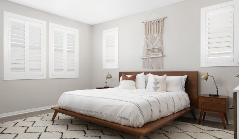 Open shutter louvers will help any St. George room feel larger. Plantation shutters in a model home bedroom.