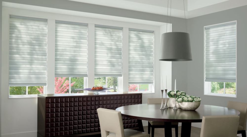 Custom cordless roller shades have a clean look and are appropriate for any room. Cordless motorized shades in a St. George dining room