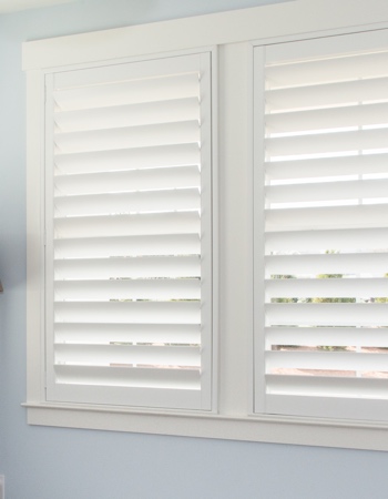 Hidden tilt rod shutters closed. White plantation shutters with hidden tilt rods in St. George