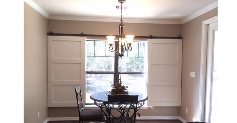 Barn doors open horizontally with slides instead of cords. St. George barn door shutters