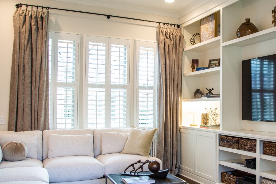 Install sun-resistant Polywood shutters in St. George. Shutters in a living room