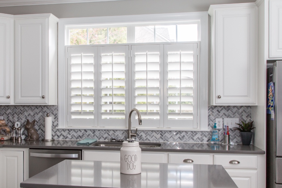 Classic Polywood interior shutters in St. George are moisture-resistant. White Polywood shutters above a kitchen sink