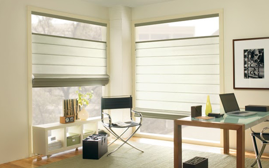 Upgrade your windows with stylish window shades or shutters in St. George. Stylish sheer shades in the corner of a modern office.