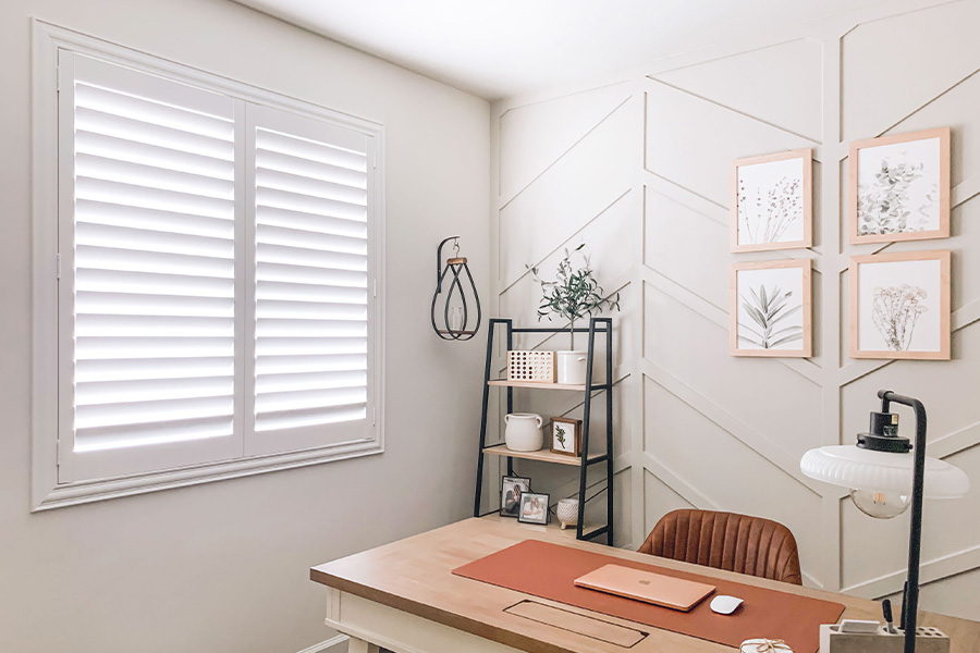 Polywood shutters give you maximum control over natural light in your St. George home. Photo Credit: @OurLakepoint Farmhouse White and off-white farmhouse style office with natural light from polywood shutters.