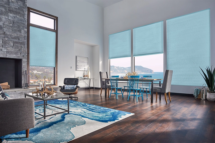 Smart motorized window shades are perfect on tall windows in your St. George home. Blue motorized shades on tall living room windows